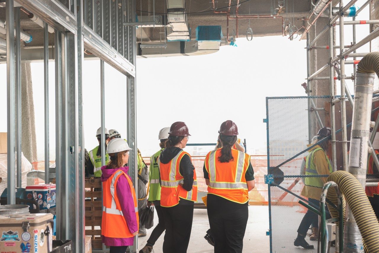 group of people wearing construction gear