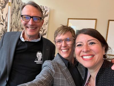 three people taking a selfie