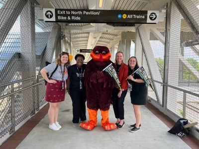 women and HokieBird
