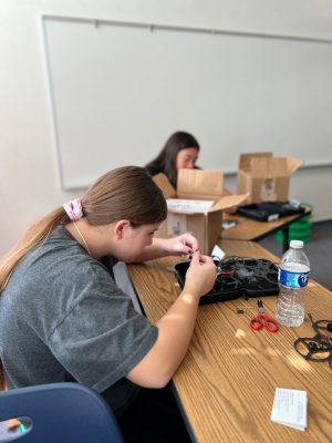 student builds a drone