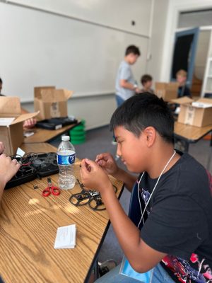 student builds a drone