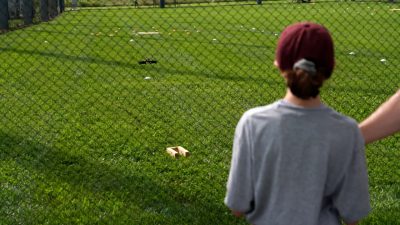 student flying drone