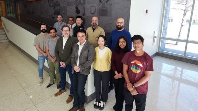 Interdisciplinary team working on a computer based on the pericyte, a type of cell found in the brain. From left, front row: Moody Awad, Atharva Agashe, Noel Naughton, Suyi Li, Jun Wang, Aporva Khairnar, and Yogesh Phalak. From left, back row: Johannes Riemenschneider, Amrinder Nain, Ziyang Zhou, Benjamin Jantzen, and Gil Hersch. Photo by Alex Parrish for Virginia Tech.