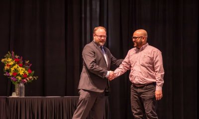 Rohit Pandey accepting award.