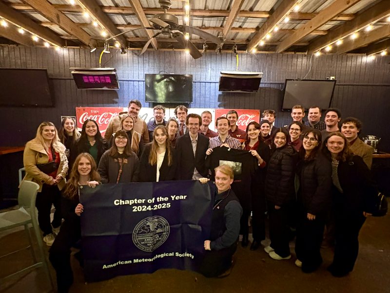 Meteorology Club members posing with banner