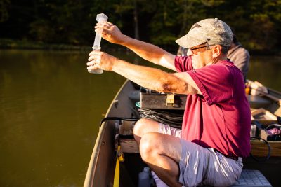 Taking a water sample from reservoir
