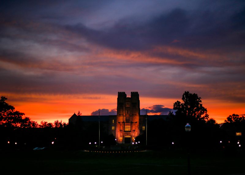 Burrus Hall appears from the Drillfield at sunset