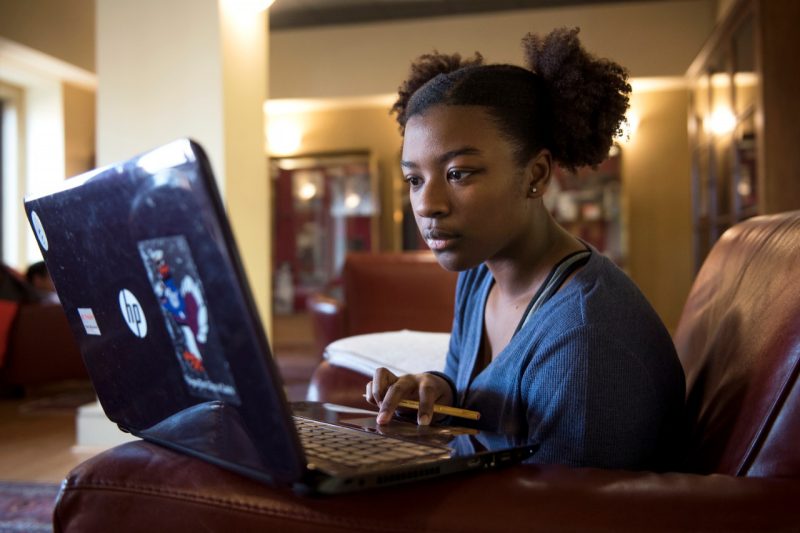 Student works at laptop