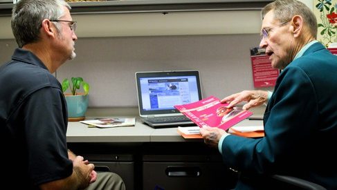 Vet-to-Vet program volunteer T.O. Williams III, at right, talks with veteran Bill Whitsett about finding employment.