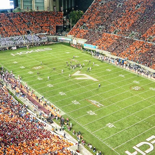 I'm a hokie. VT25. Phone Wallpaper. White text multi-outlined in rainbow colors on pink background