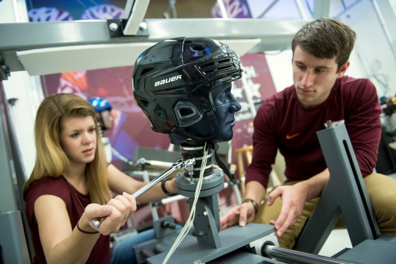 Graduate students work in the helmet lab