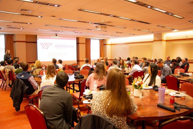 An appreciation lunch and three new awards were a part of National Postdoc Appreciation Week at Virginia Tech.  Shown is a presenter announcing award winners infront of attendees.
